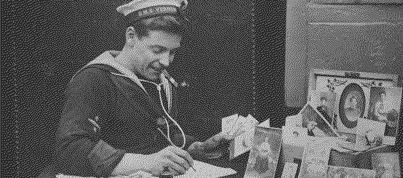 Vintage photo of a sailor writing letters.